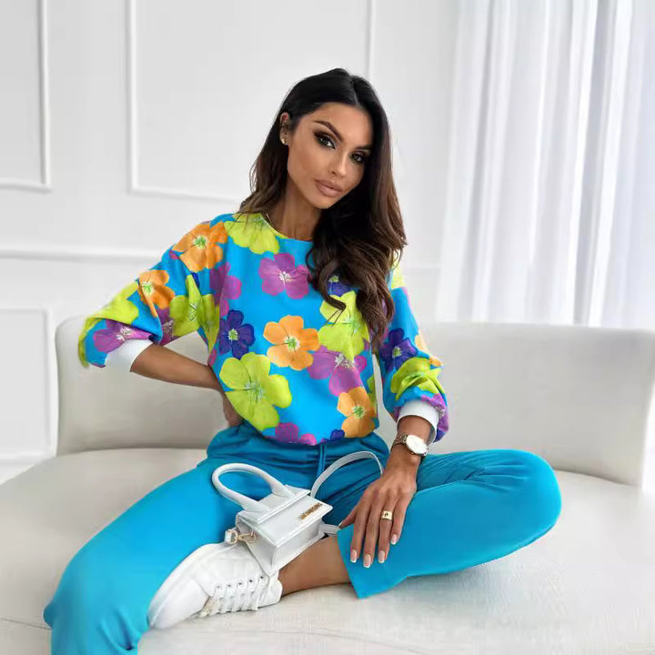 Casual women's sweatshirt with a colorful floral pattern and drop shoulders Lune London