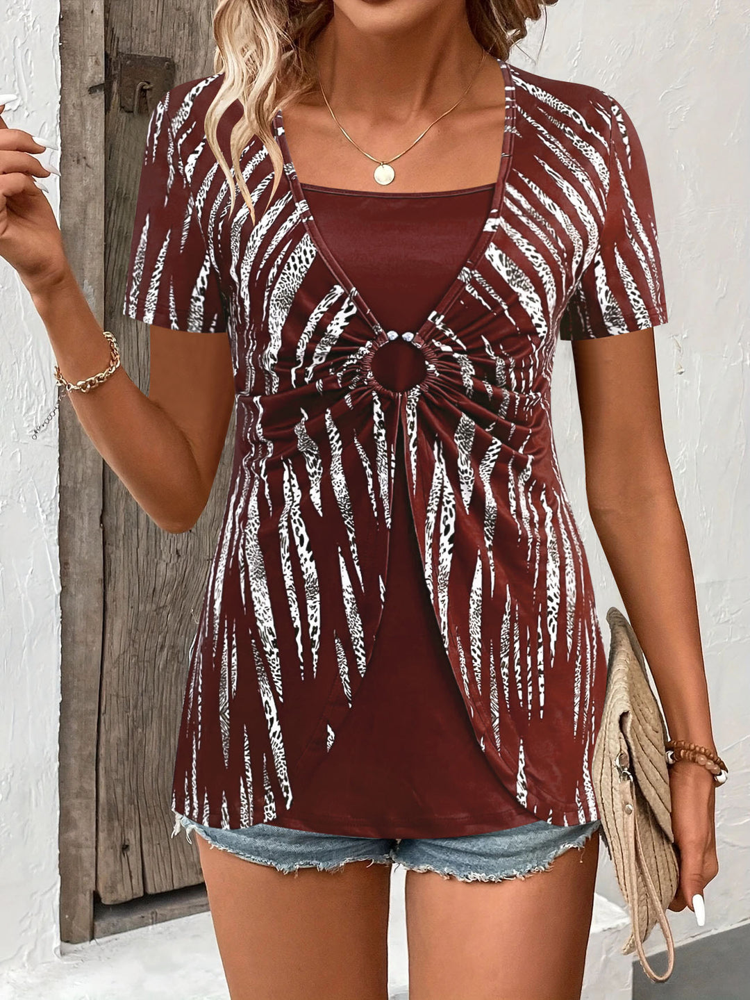 Women's top with decorative knot details and a modern pattern Lune London