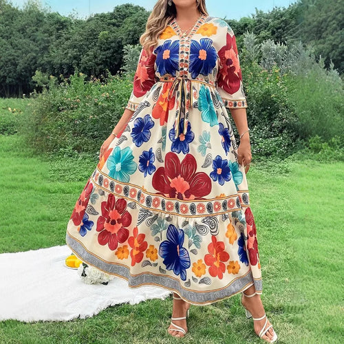 Women's maxi dress with colorful floral design and waist belt Lune London