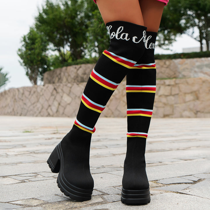 Women's boots in portrait format with colorful striped pattern and trendy block heel Lune London