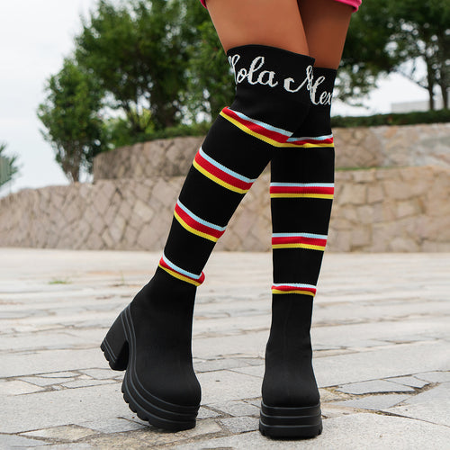 Women's boots in portrait format with colorful striped pattern and trendy block heel Lune London