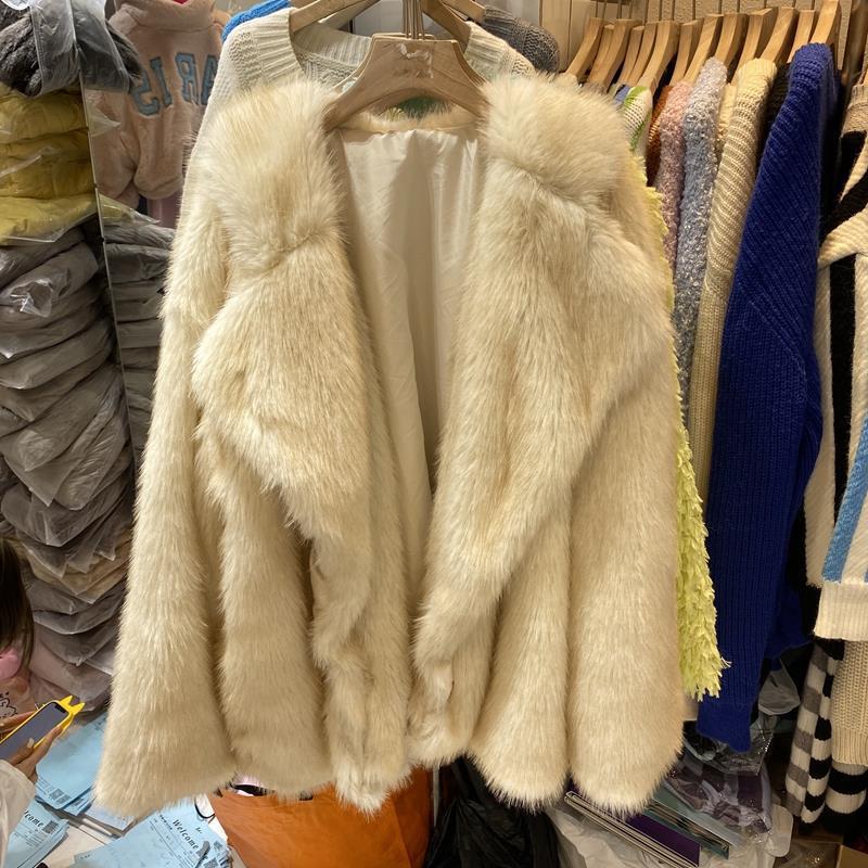 Ladies Oversized Hooded Puffer Coat with Chic and Stylish Large Surface Texture