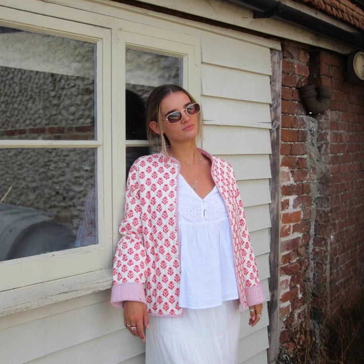 Trendy bomber jacket for women with floral pattern and practical button details Lune London