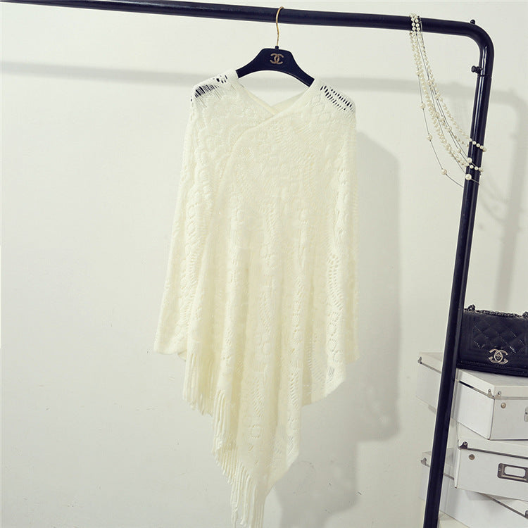 Knit poncho for women with an eye-catching crochet pattern and fashionable fringes Lune London