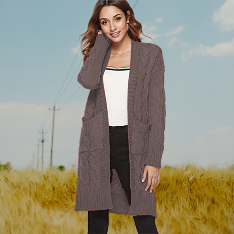 Chunky knit cardigan for women with an elegant cable design and practical pockets Lune London