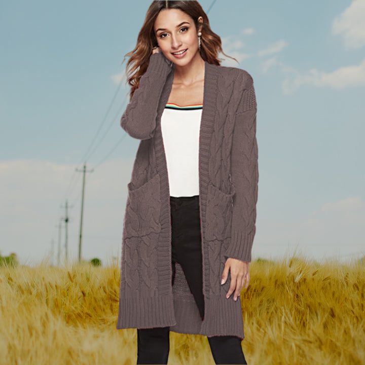 Chunky knit cardigan for women with an elegant cable design and practical pockets Lune London