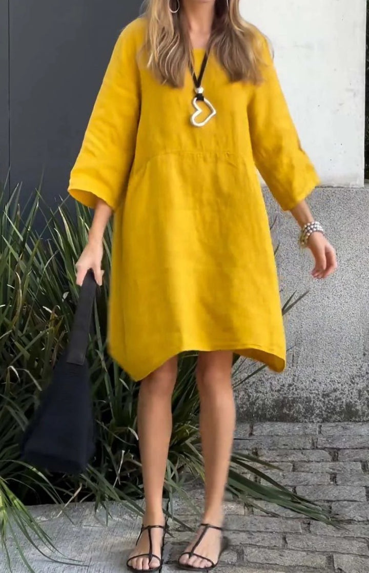 Casual linen dress for women with practical pockets and asymmetrical hem Lune London