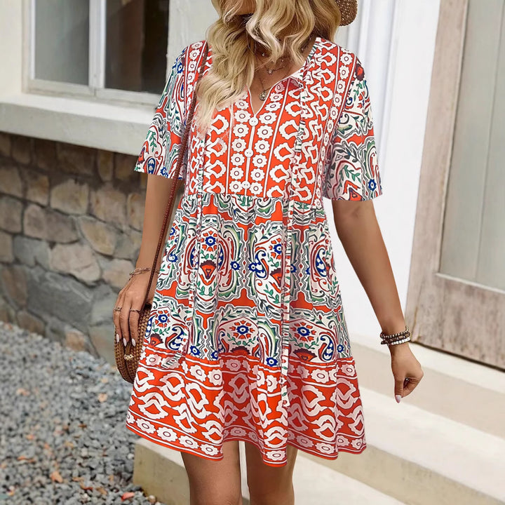 Lightweight summer dress for women with a flattering cut for curves and a playful pattern Lune London