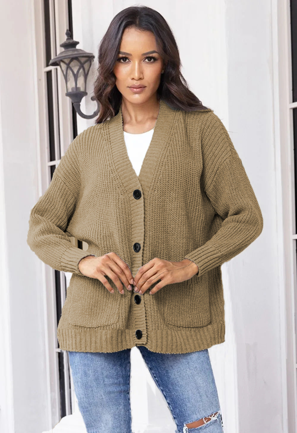 Fashionable knitted jacket for women with button closure all the way down and large pockets Lune London