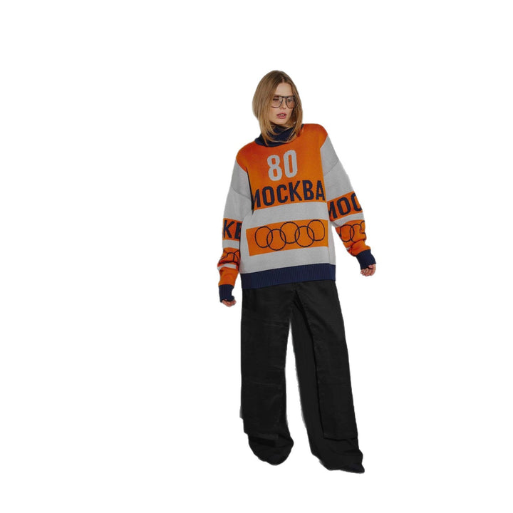 Pull décontracté pour femmes avec un design graphique accrocheur et un ourlet profond Chic & Stil