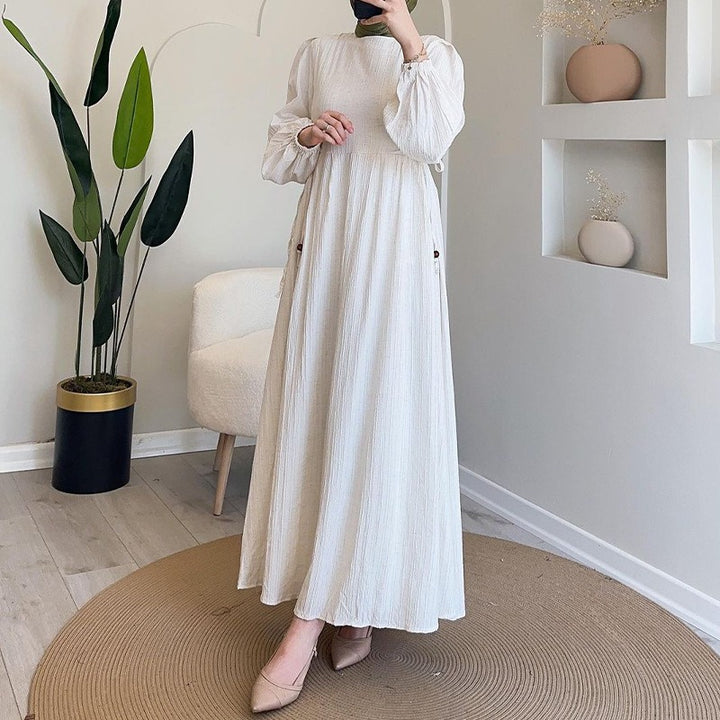 Maxi dress for women with an elegant pleated design and long puff sleeves Lune London