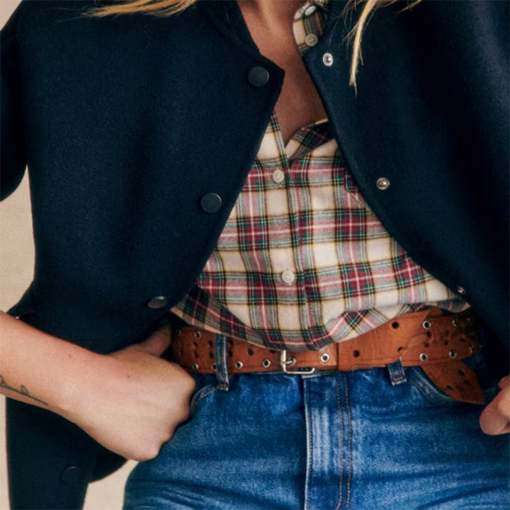 Modern short jacket for women with button details and side pockets. Chic and style