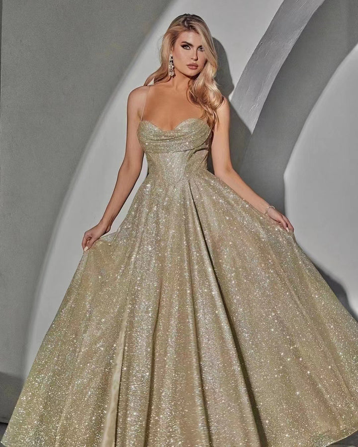 Glamorous evening dress for women with deep neckline and sparkling fabric Lune London