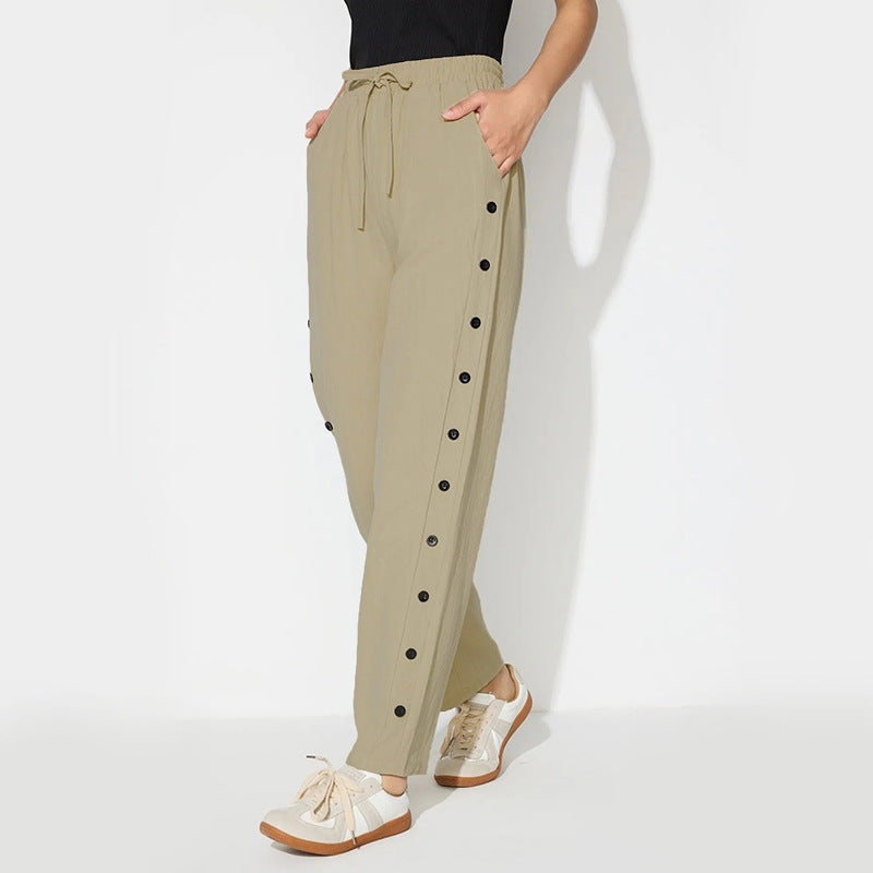 Women's fashionable jogger pants with decorative button details Chic & Stil