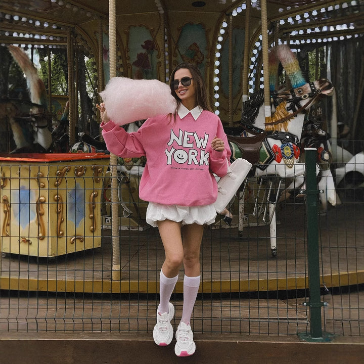 Casual hoodie for women with a cheerful smiley print and a soft inner lining Lune London