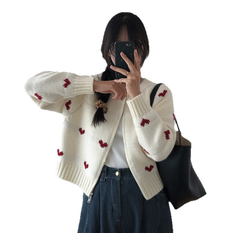 Ladies comfortable cardigan with heart pattern and chic style elegant button detail