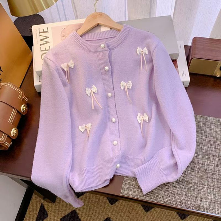Knit jacket for women with feminine appliques and chic button details
