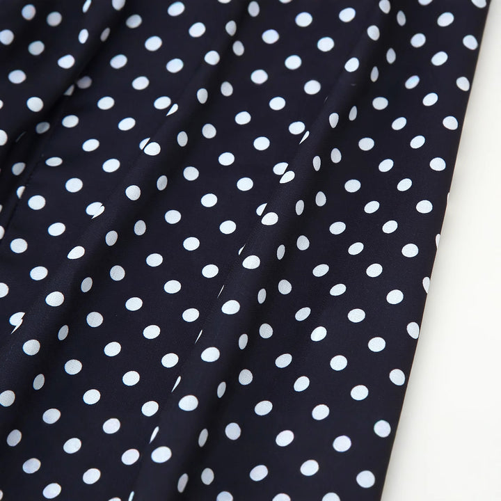 Midi dress for women with thin spaghetti straps and a playful polka dot design Lune London