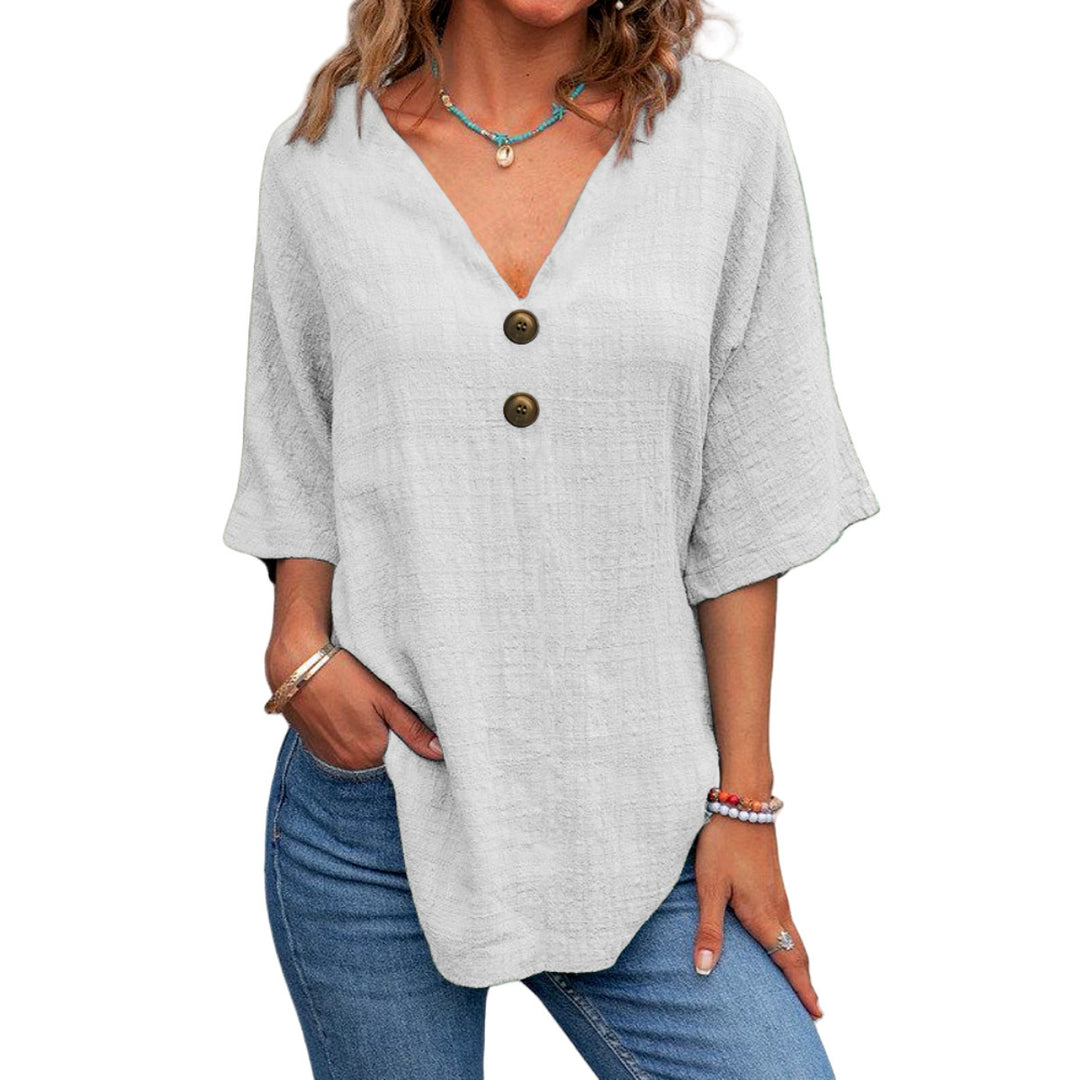 Ladies' V-neck blouse with decorative buttons and chic casual cut