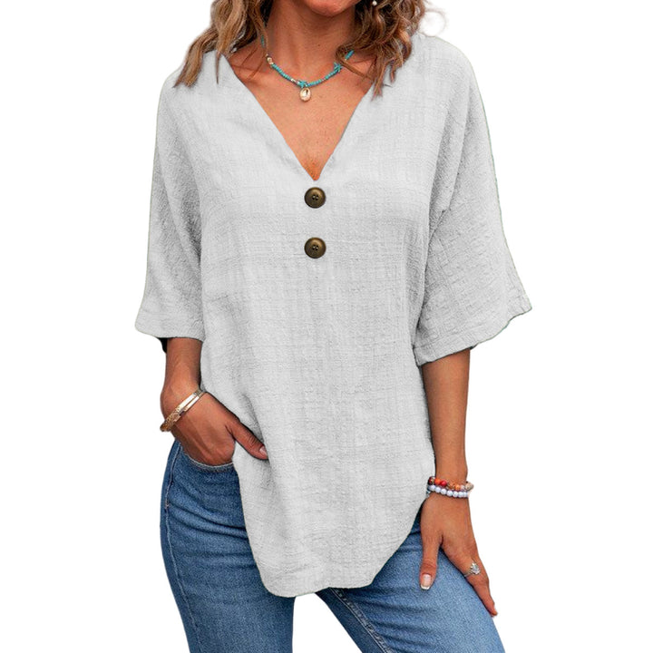 Ladies' V-neck blouse with decorative buttons and chic casual cut