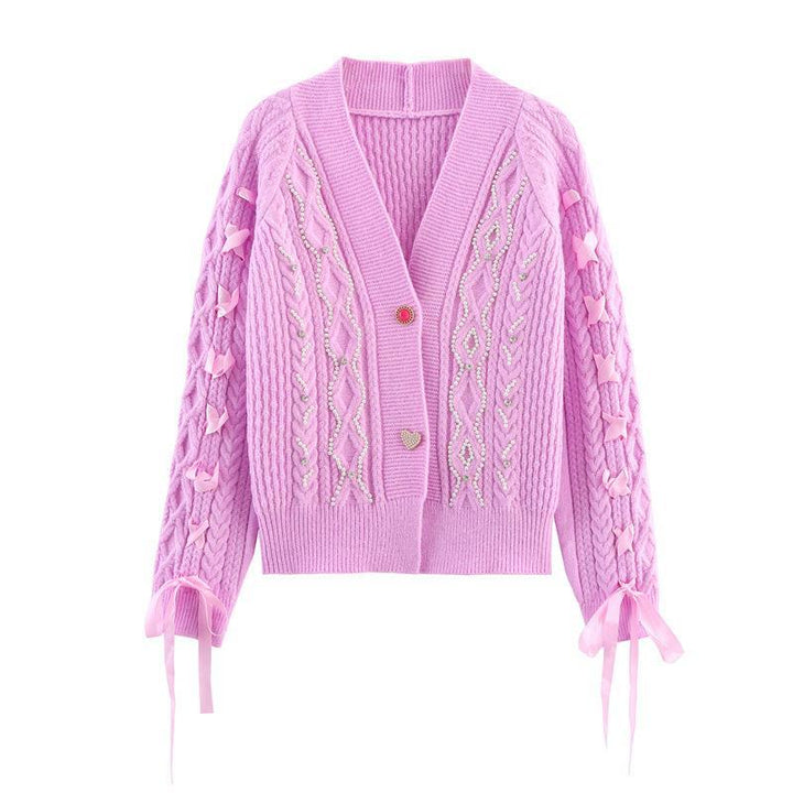 Knitted jacket for women with a detailed textured pattern and elegant ruffle details Lune London