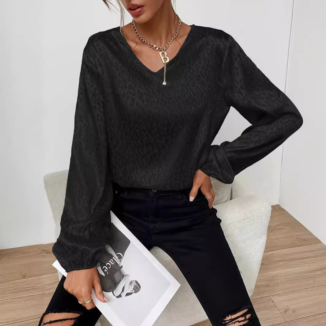 Blouse élégante pour femmes avec col en V et manches volumineuses Chic & Stil