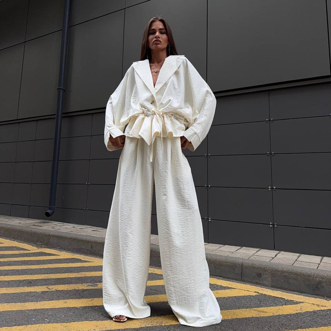 Trendy women's jumpsuit with a wide cut and cinched belt Lune London