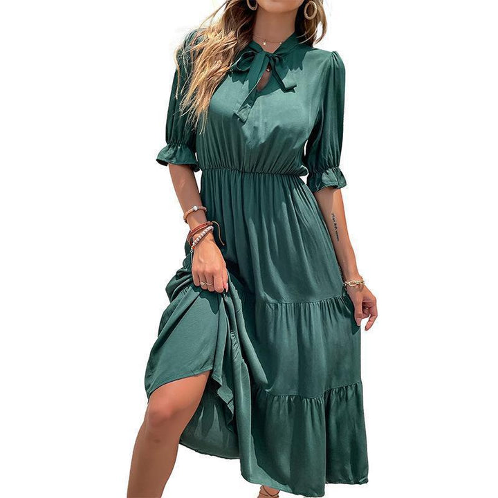 Maxi dress for women with an elegant high collar and a voluminous ruffled hem Lune London