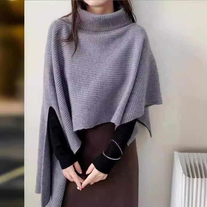 Ladies knitted poncho with high collar and asymmetrical cut Lune London