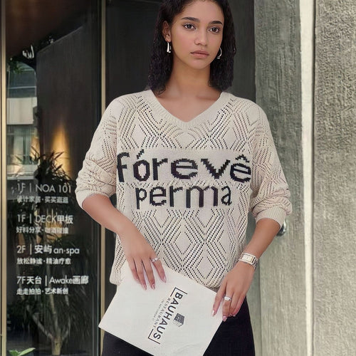 Trendy knitted sweater for women with a creative honeycomb pattern and a textured detail Lune London