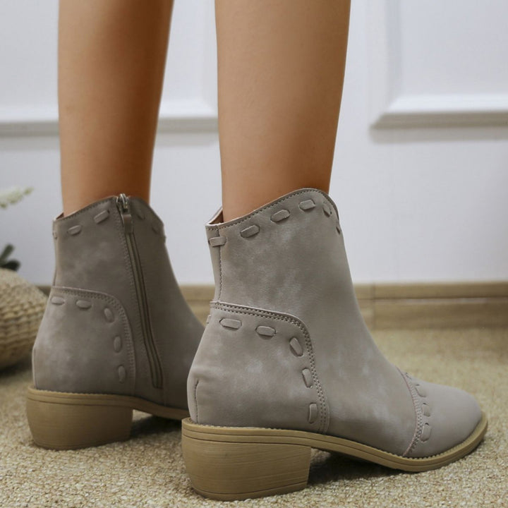 Elegant ankle boots for women with trendy decorative stitching and a practical zipper Lune London