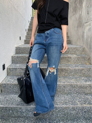 Women’s ripped wide jeans with cut-out details Lune London