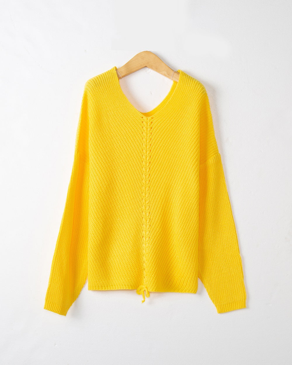 Women's thick knit sweater with an attractive V-neckline and practical drawstring details Lune London