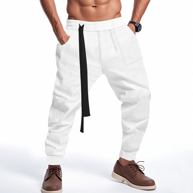 Casual men's jogging pants in textured fabric with elastic waist and drawstring Lune London