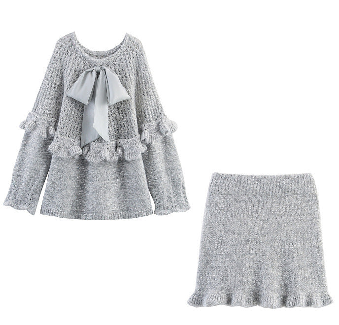 Elegant ladies knitted outfit with ruffles and bow accents Lune London