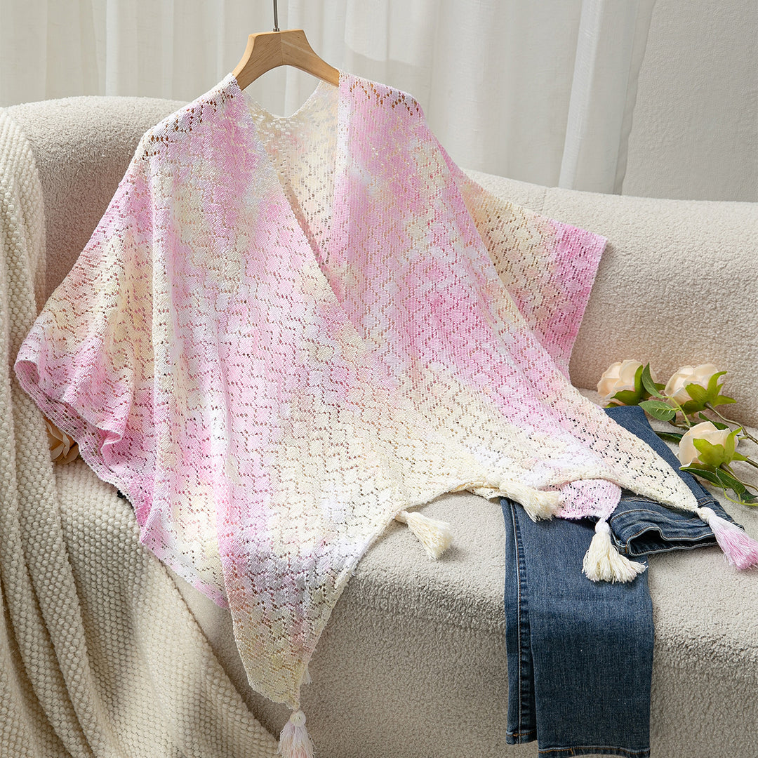 Airy knitted poncho for ladies with decorative fringes Lune London