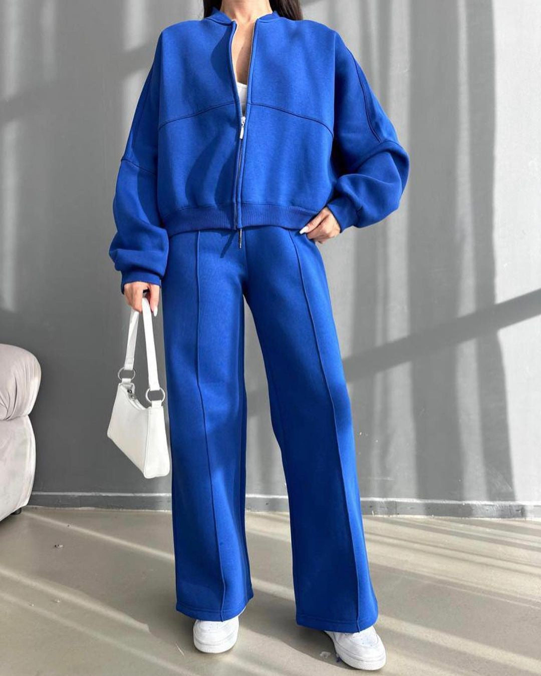 Casual look for women with a casual zip jacket and wide pants Lune London