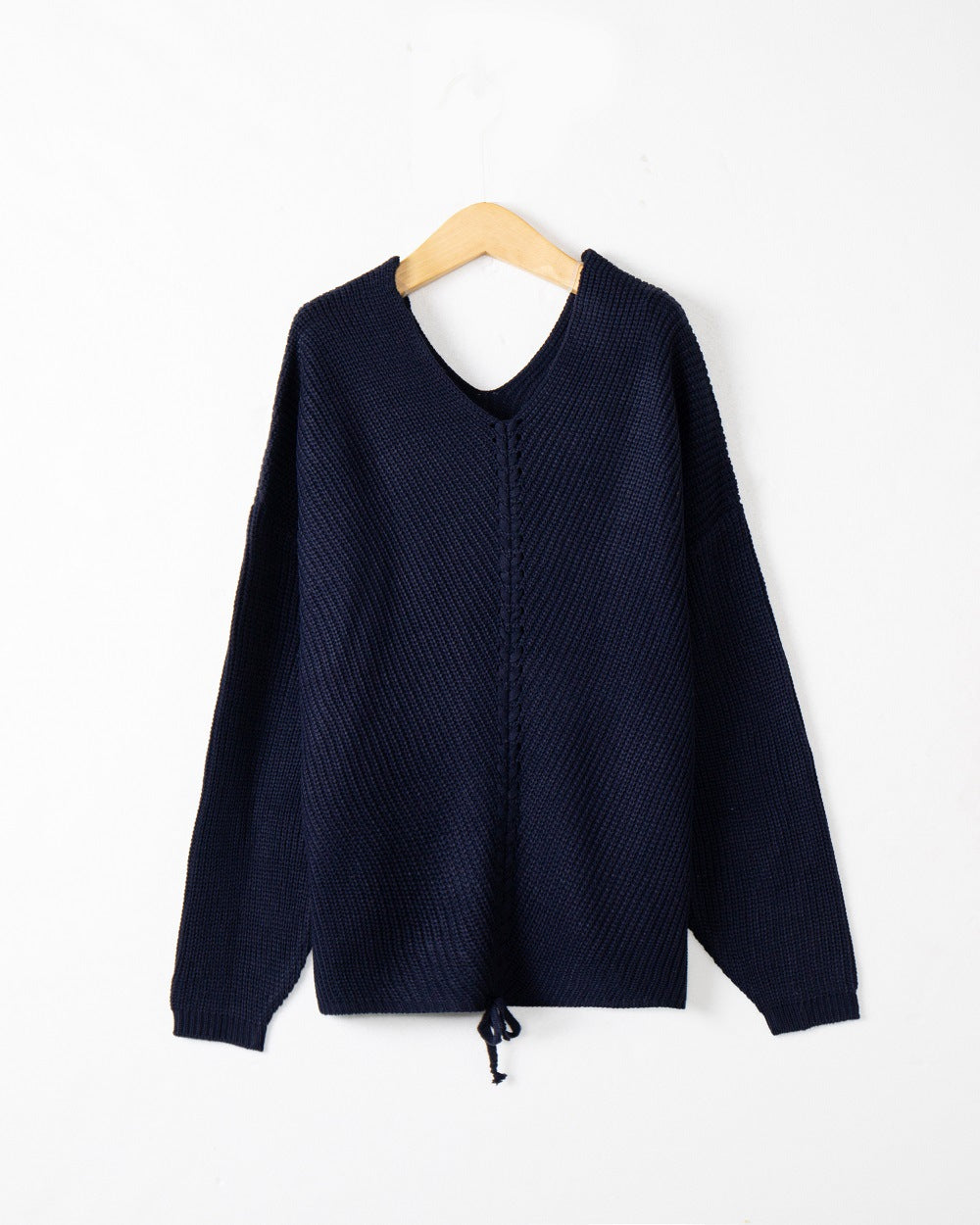 Women's thick knit sweater with an attractive V-neckline and practical drawstring details Lune London