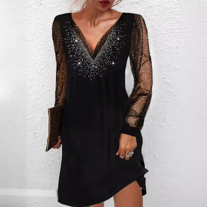 Elegant evening dress for ladies with shimmering accents and sheer sleeves Lune London