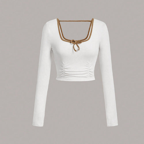 Long sleeve cropped top for women with an elegant square neckline and sophisticated knot details Chic & Stil