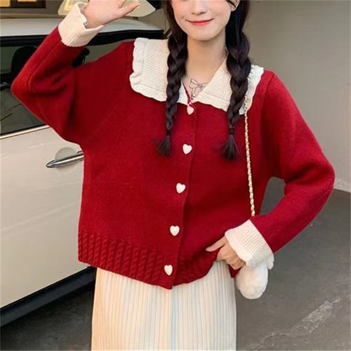 Knitted women's jacket with heart-shaped buttons and a distinctive ruffle collar Lune London