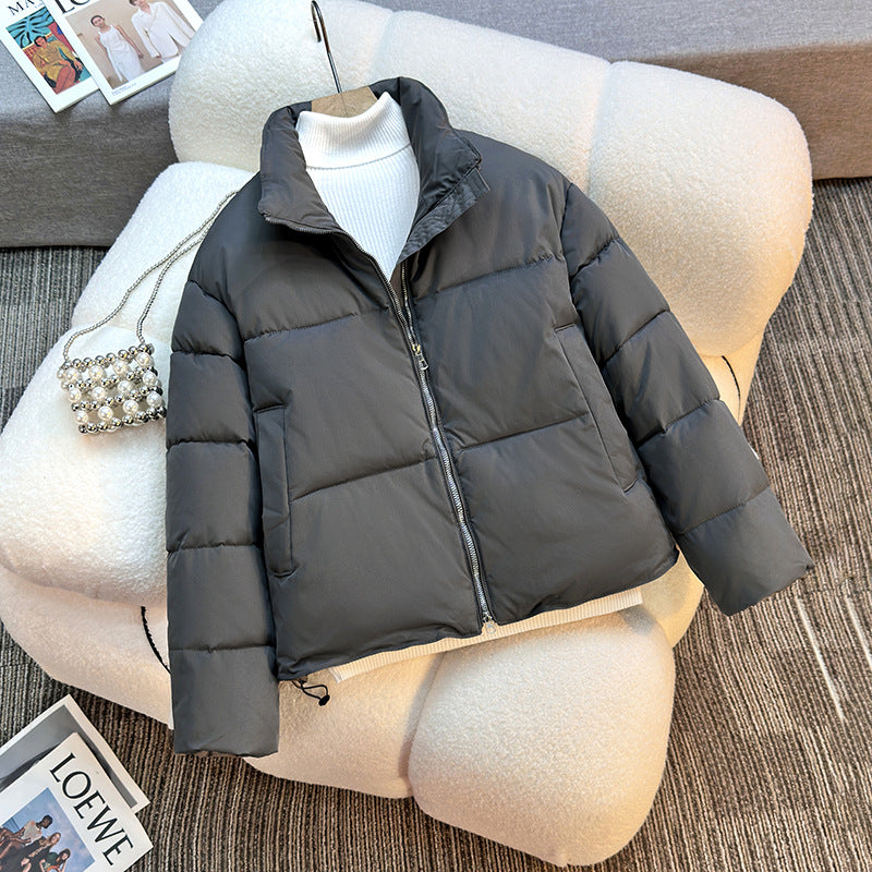 Short quilted jacket for women with high collar and practical piped pockets Lune London