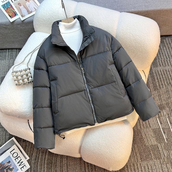 Short quilted jacket for women with high collar and practical piped pockets Lune London