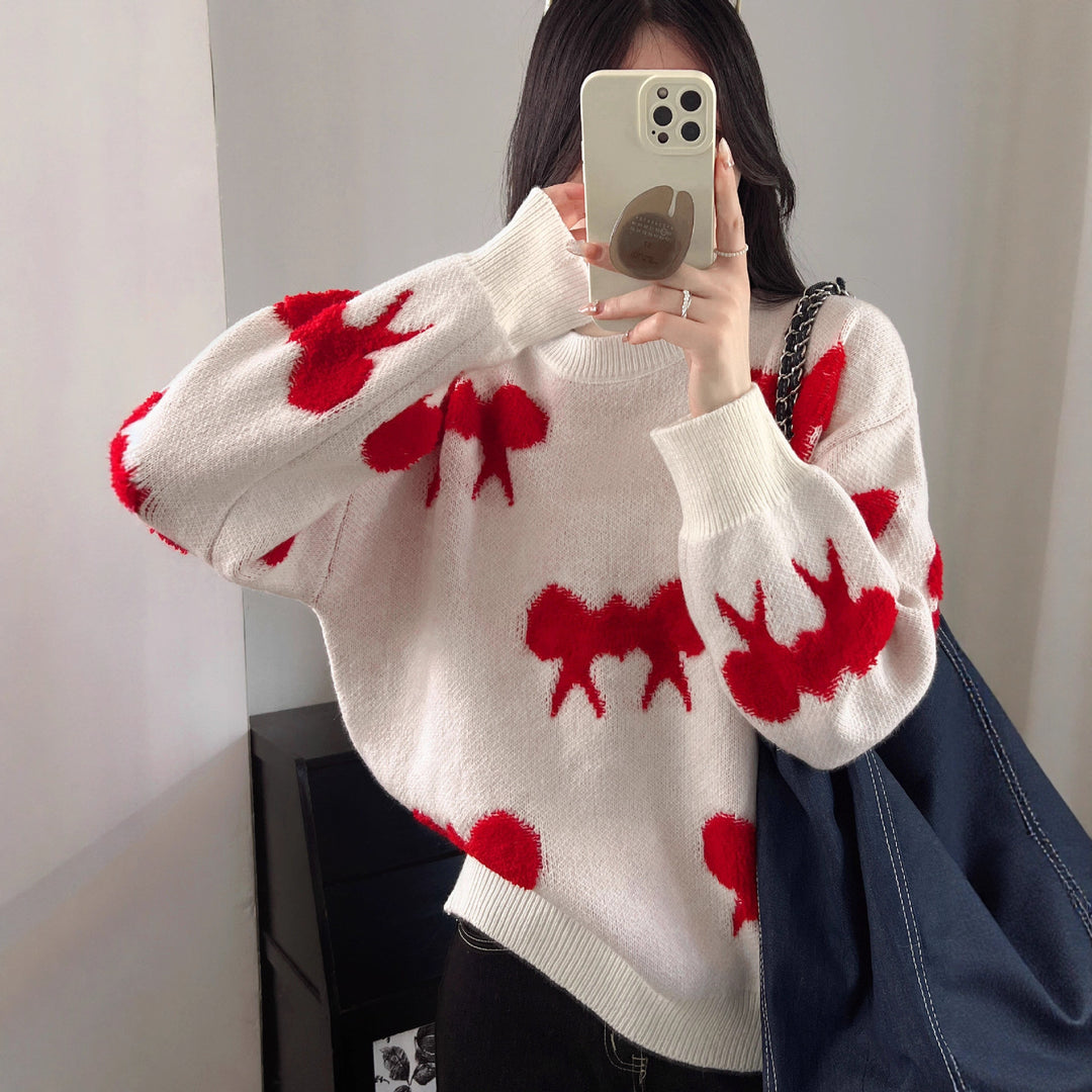 Cozy knitted sweater for women with playful bow pattern Lune London