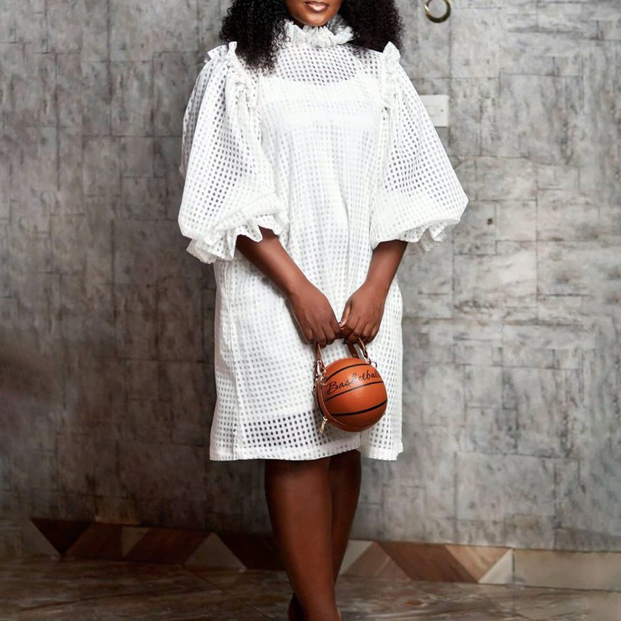 Transparent dress for women with voluminous puff sleeves and a chic check pattern.