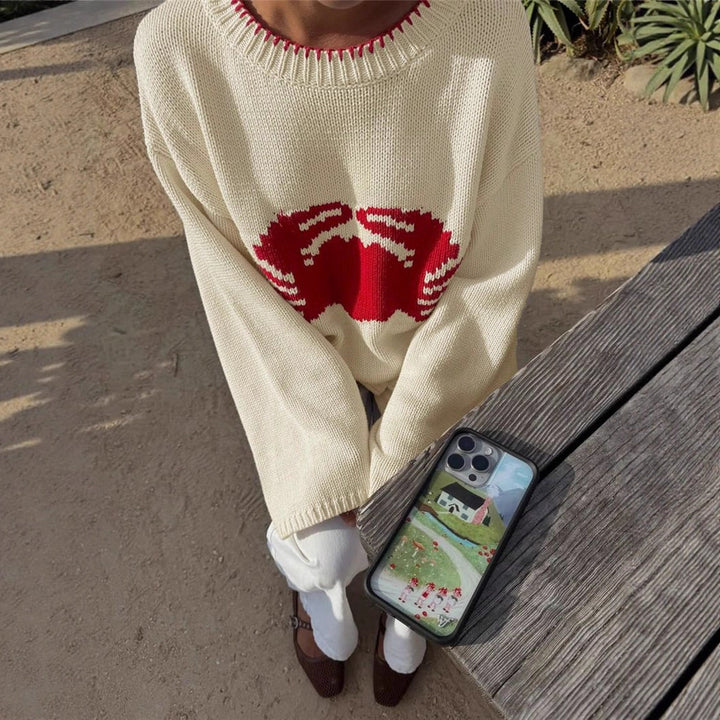 Knitted sweater for women with a climbing creature design Lune London