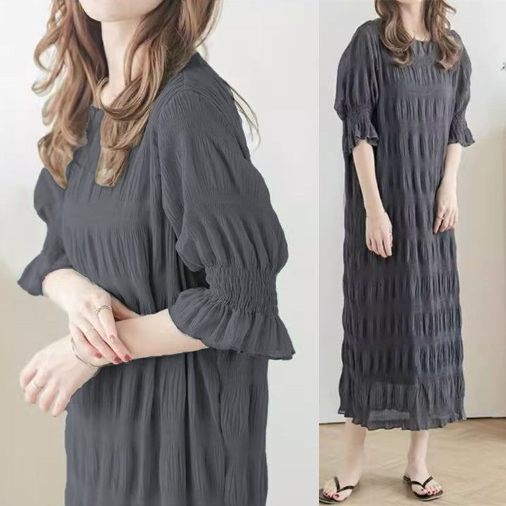 Casual maxi dress for women with elastic puff sleeves and a refined textured design Lune London