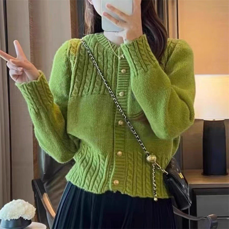 Ladies cozy knit pullover with cable texture and chic gold button details