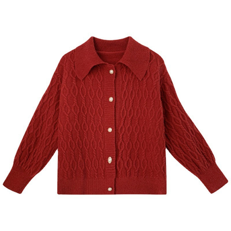 Ladies chunky sweater with an elegant cable knit pattern and chic pearl buttons