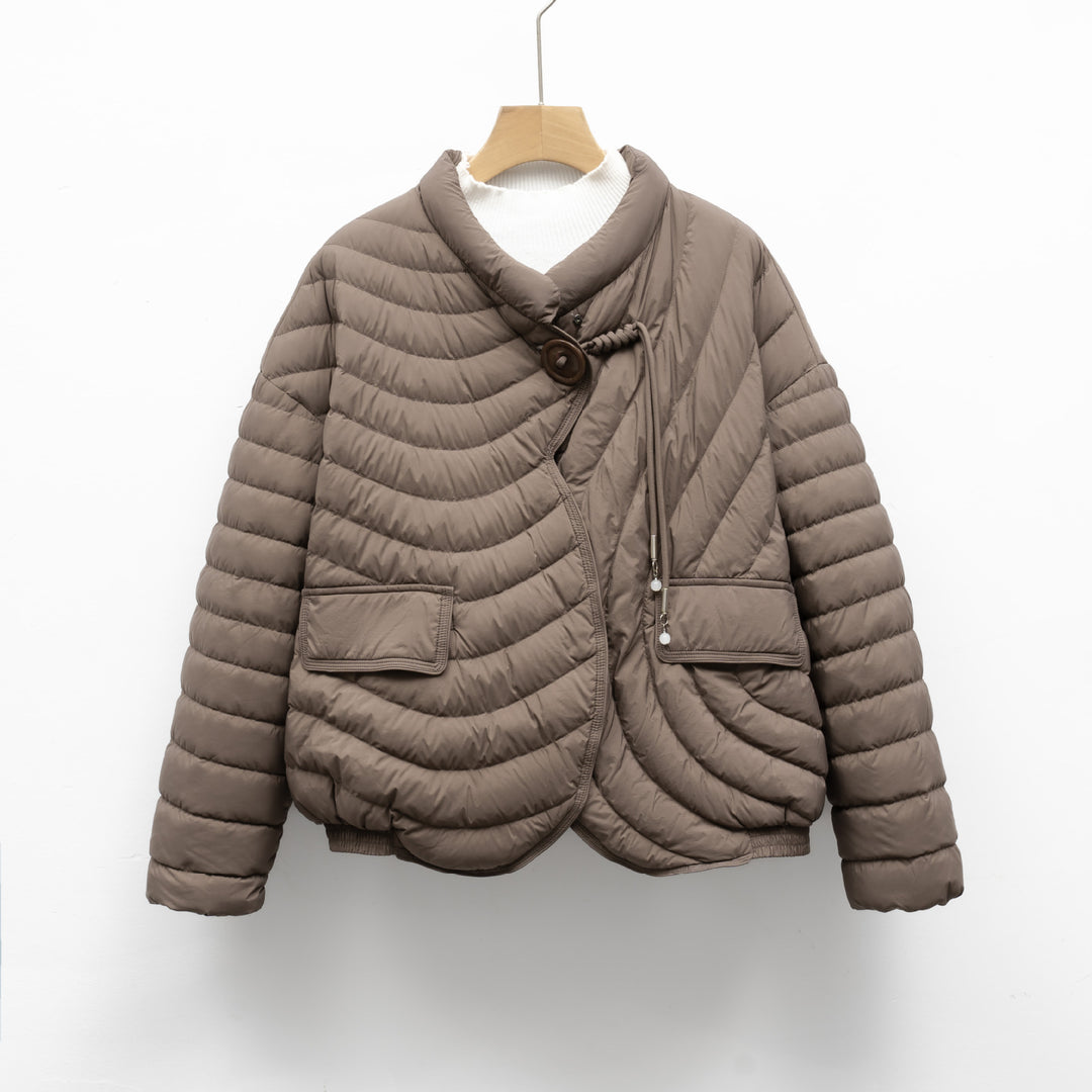 Trendy quilted jacket for women with asymmetrical cut and practical pockets Lune London